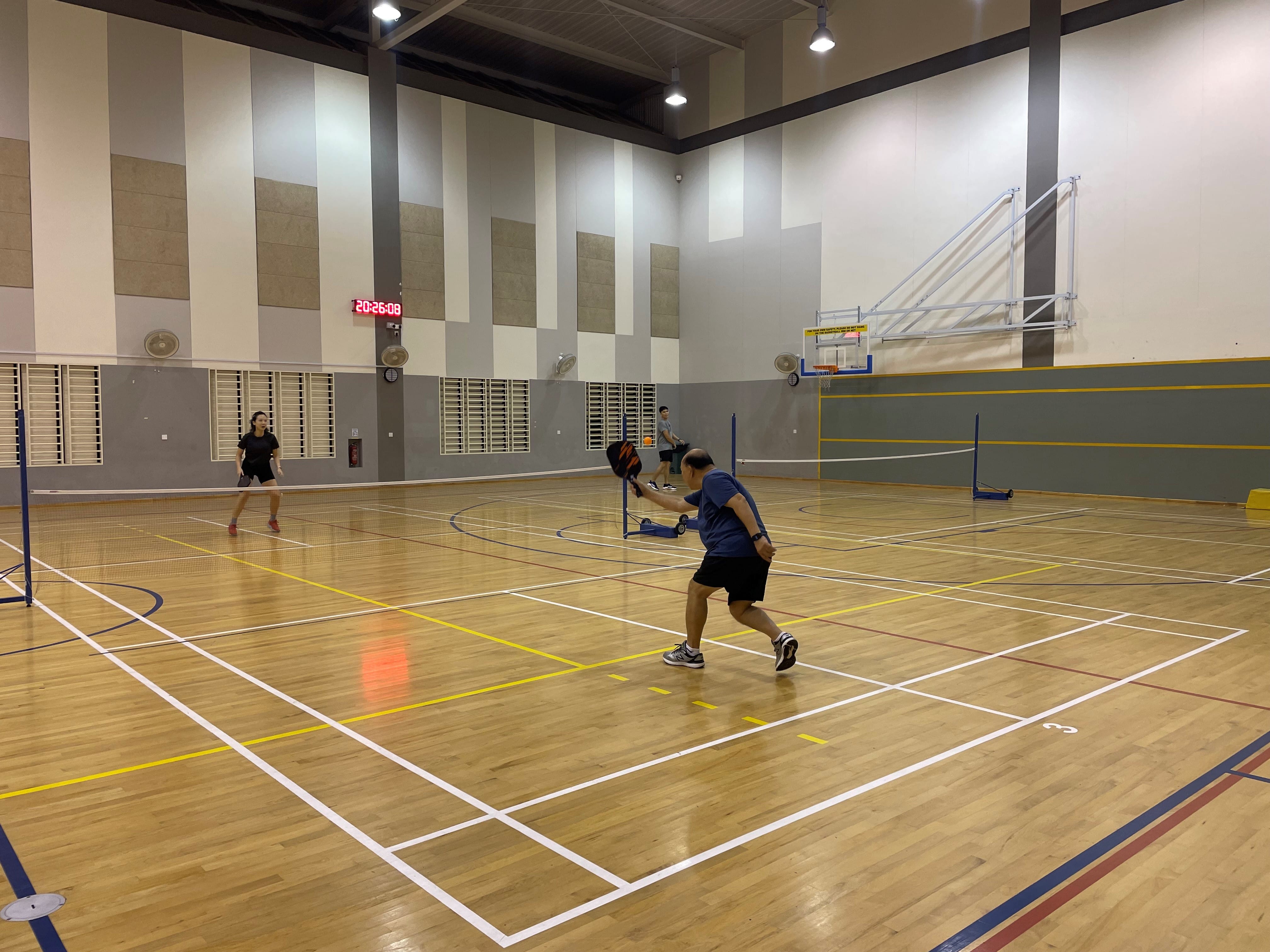 Someone playing pickleball
